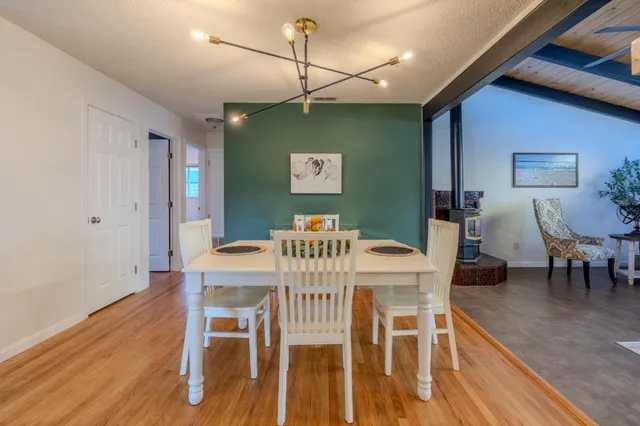 a kitchen with stainless steel appliances granite countertop a stove and a microwave