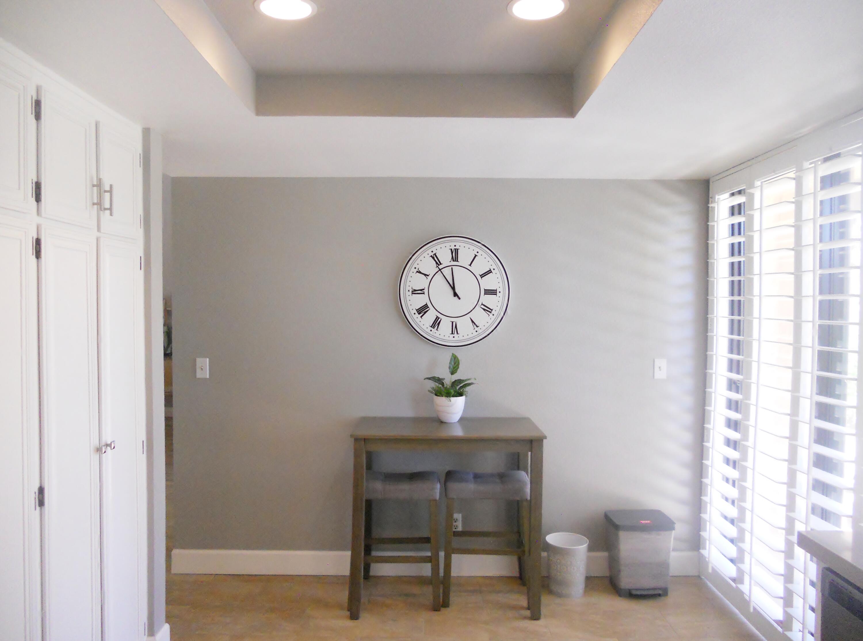 128 Castellana West Palm Desert, CA 92260 - Photo 12 of 20 a clock on a wall next to a window