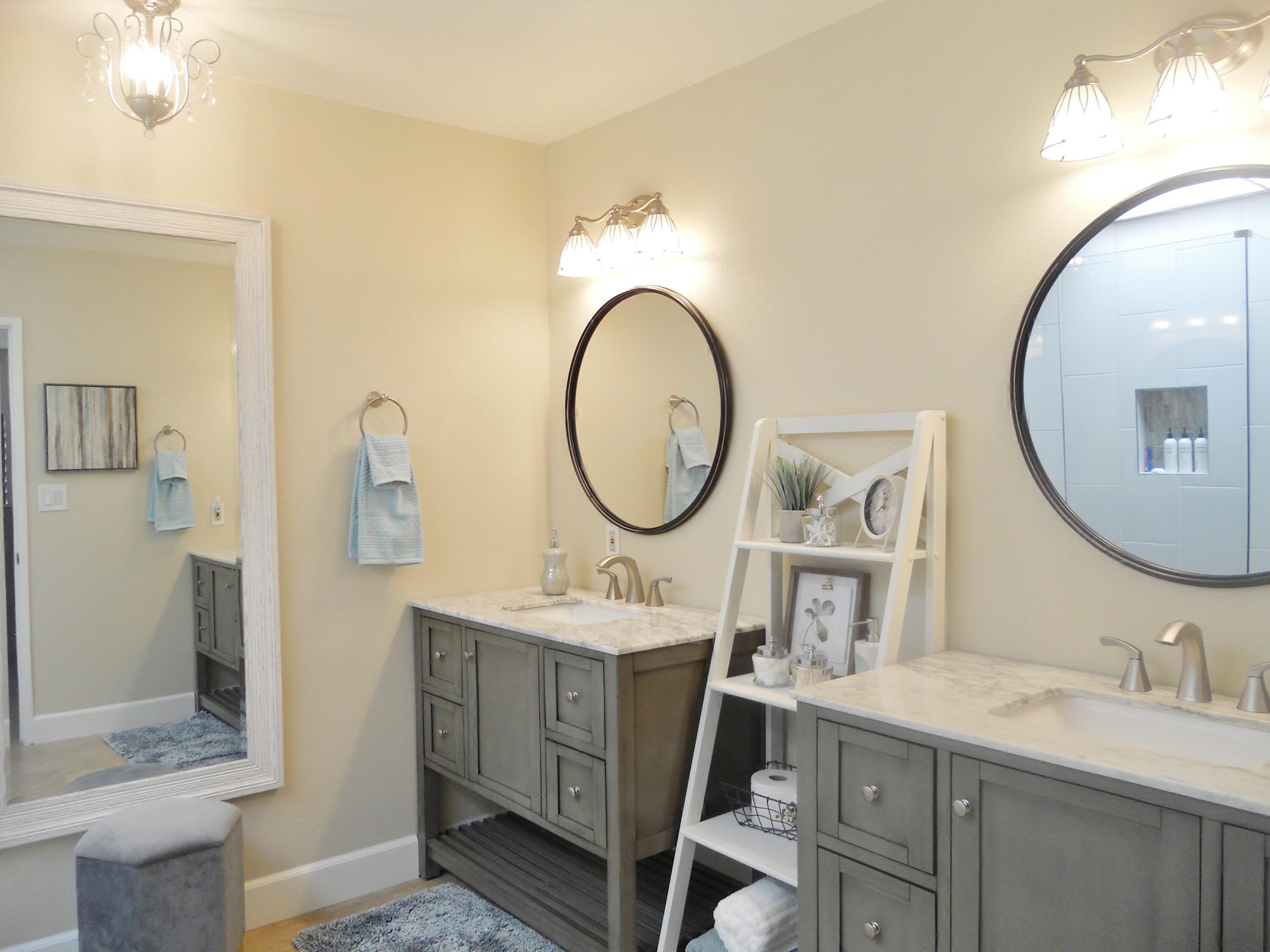 128 Castellana West Palm Desert, CA 92260 - Photo 14 of 20 a bathroom with a sink mirror and a toilet