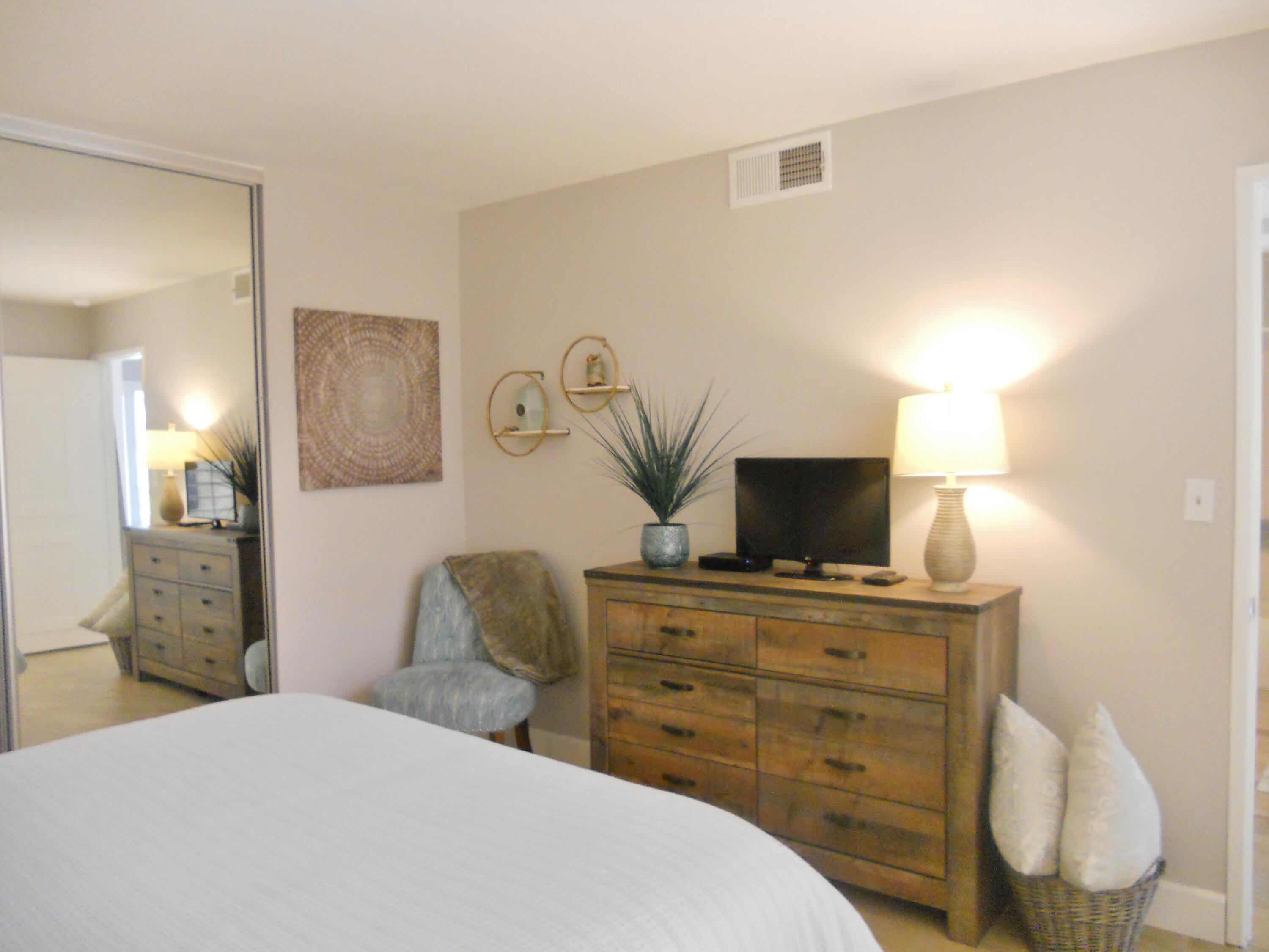 128 Castellana West Palm Desert, CA 92260 - Photo 17 of 20 a bedroom with a bed and furniture