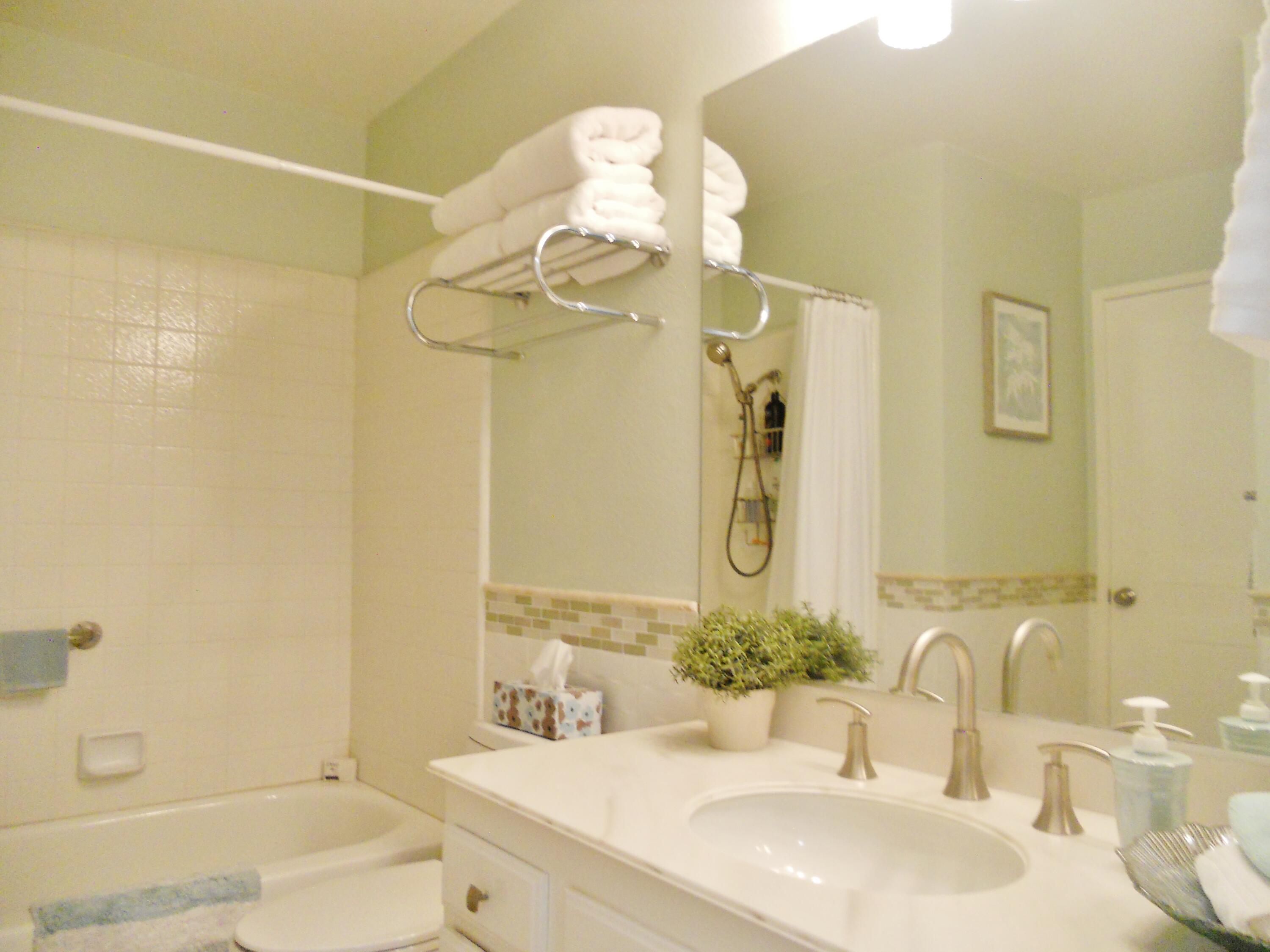 128 Castellana West Palm Desert, CA 92260 - Photo 18 of 20 a bathroom with a sink and a mirror