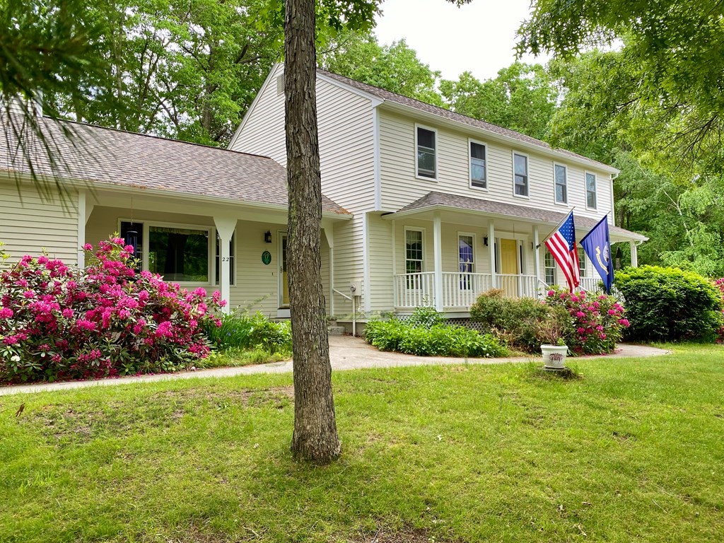 22 Old Homestead Road Groton, MA 01450 - Photo 1 of 36 a front view of a house with a garden