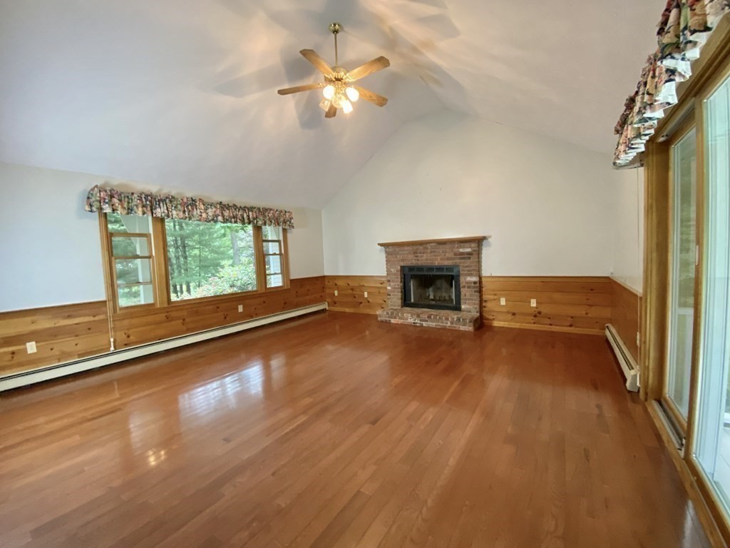 22 Old Homestead Road Groton, MA 01450 - Photo 17 of 36 a view of an empty room with a window and wooden floor