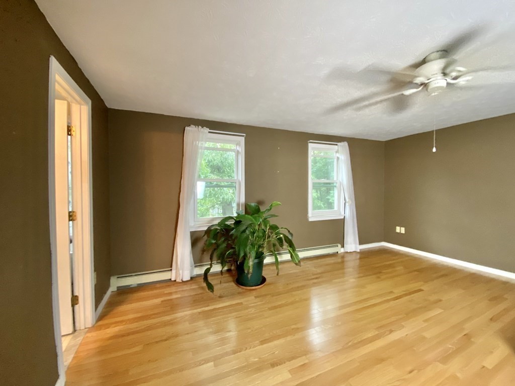 22 Old Homestead Road Groton, MA 01450 - Photo 21 of 36 a view of an empty room with wooden floor and a window
