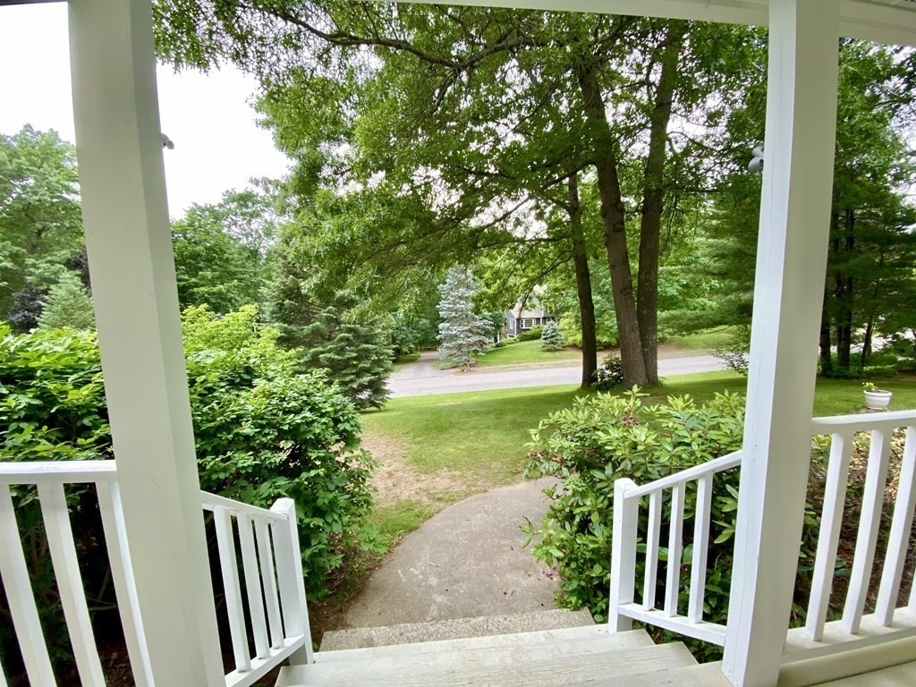 22 Old Homestead Road Groton, MA 01450 - Photo 32 of 36 a view of a garden with plants and large trees