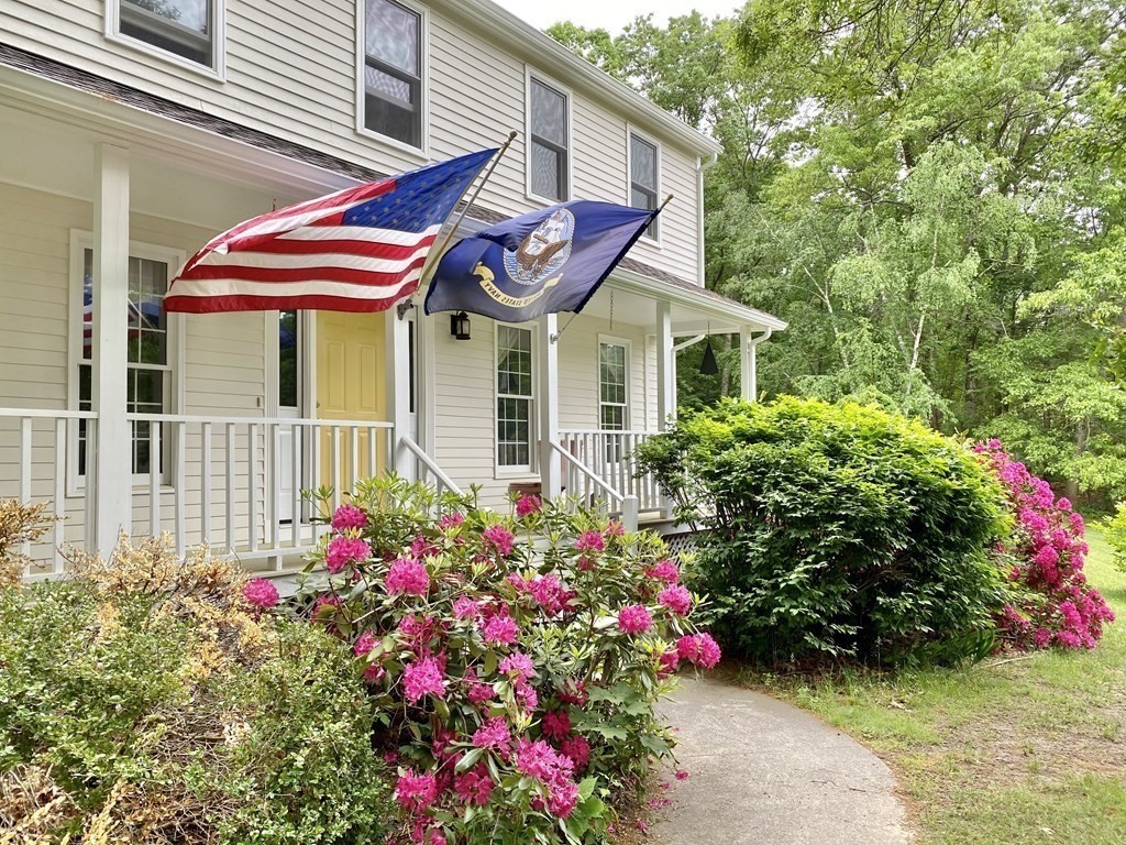 22 Old Homestead Road Groton, MA 01450 - Photo 34 of 36 a view of a house with a flower garden