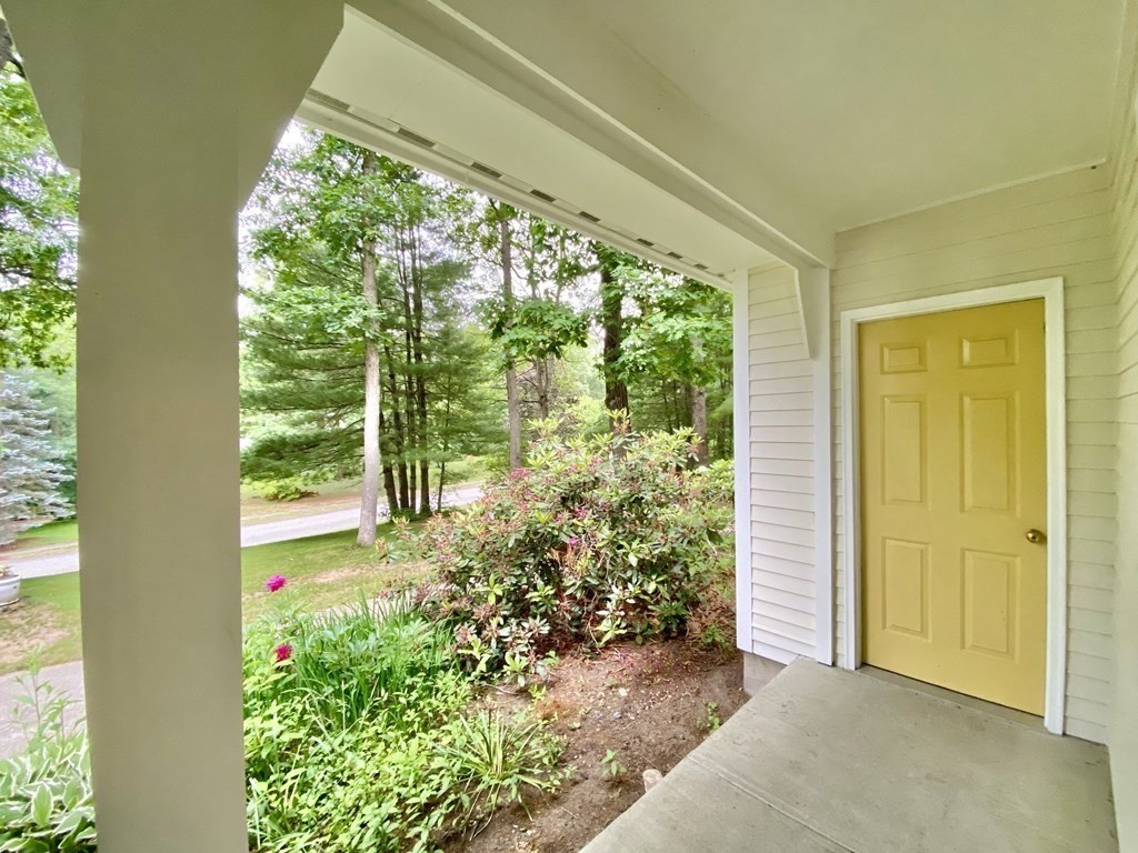 22 Old Homestead Road Groton, MA 01450 - Photo 4 of 36 a view of a garden with a fountain