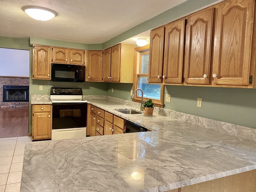 22 Old Homestead Road Groton, MA 01450 - Photo 6 of 36 a large kitchen with a large window