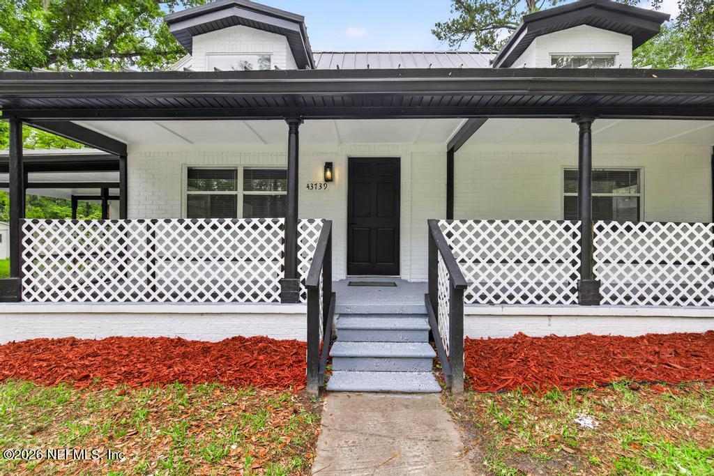 43739 Ratliff Road Callahan, FL 32011 - Photo 10 of 55 a view of outdoor space with wooden fence
