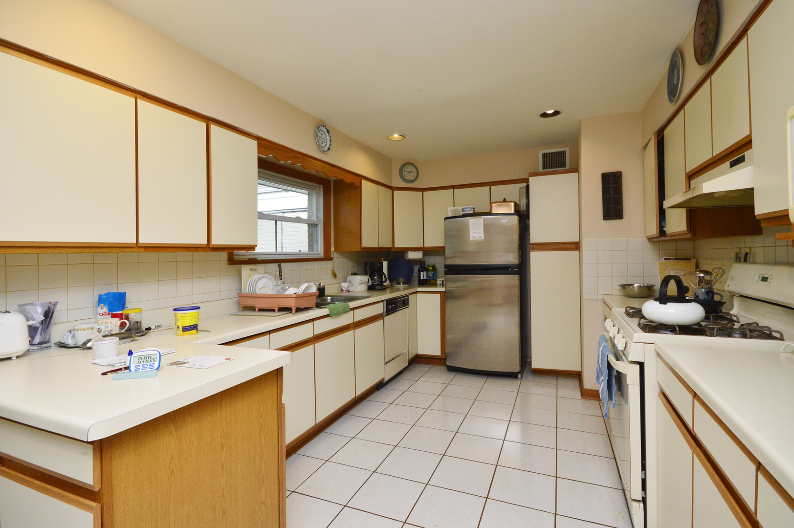 1746 Good Avenue Park Ridge, IL 60068 - Photo 4 of 11 a kitchen with stainless steel appliances granite countertop a refrigerator sink and cabinets