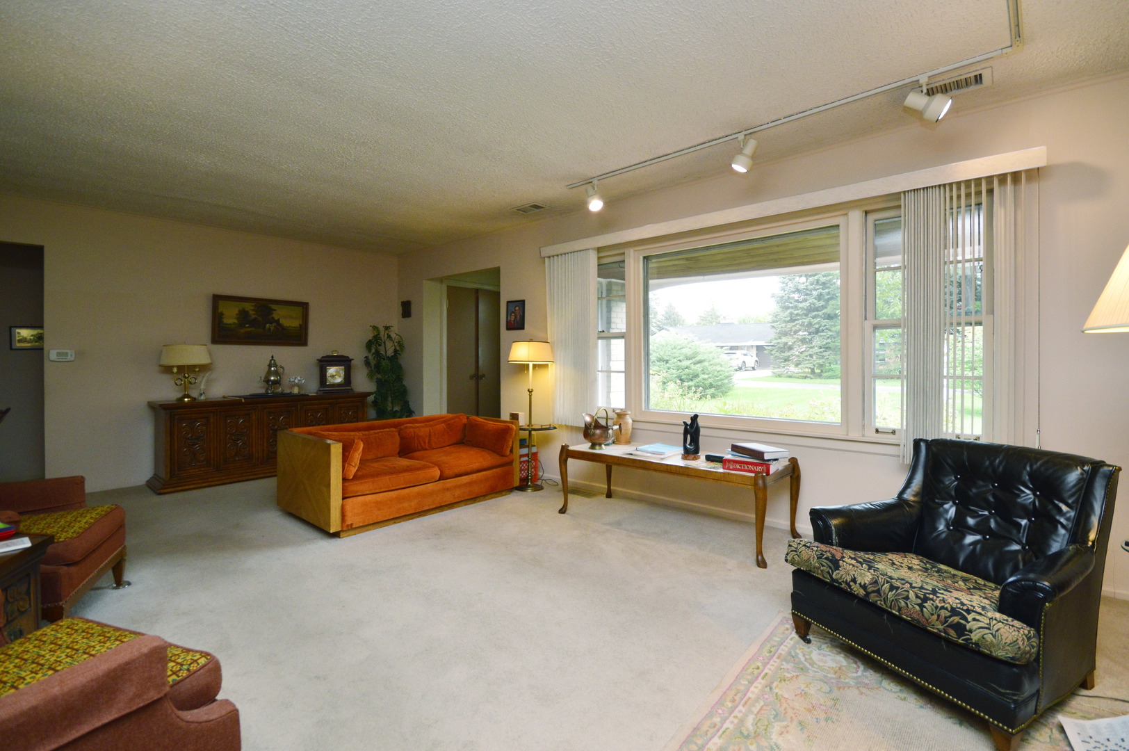 1746 Good Avenue Park Ridge, IL 60068 - Photo 6 of 11 a living room with furniture and a large window
