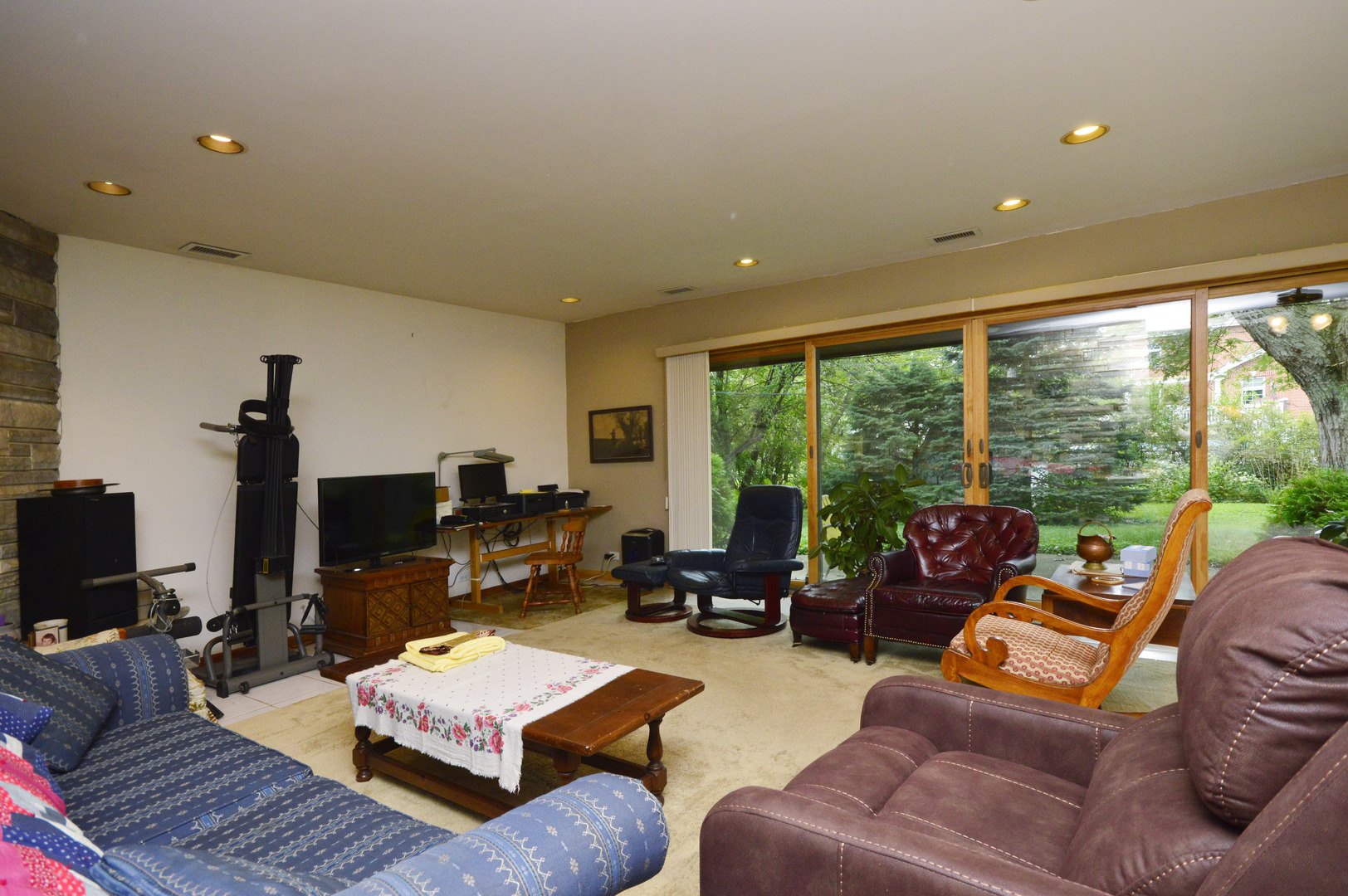1746 Good Avenue Park Ridge, IL 60068 - Photo 8 of 11 a living room with furniture a large window and a flat screen tv