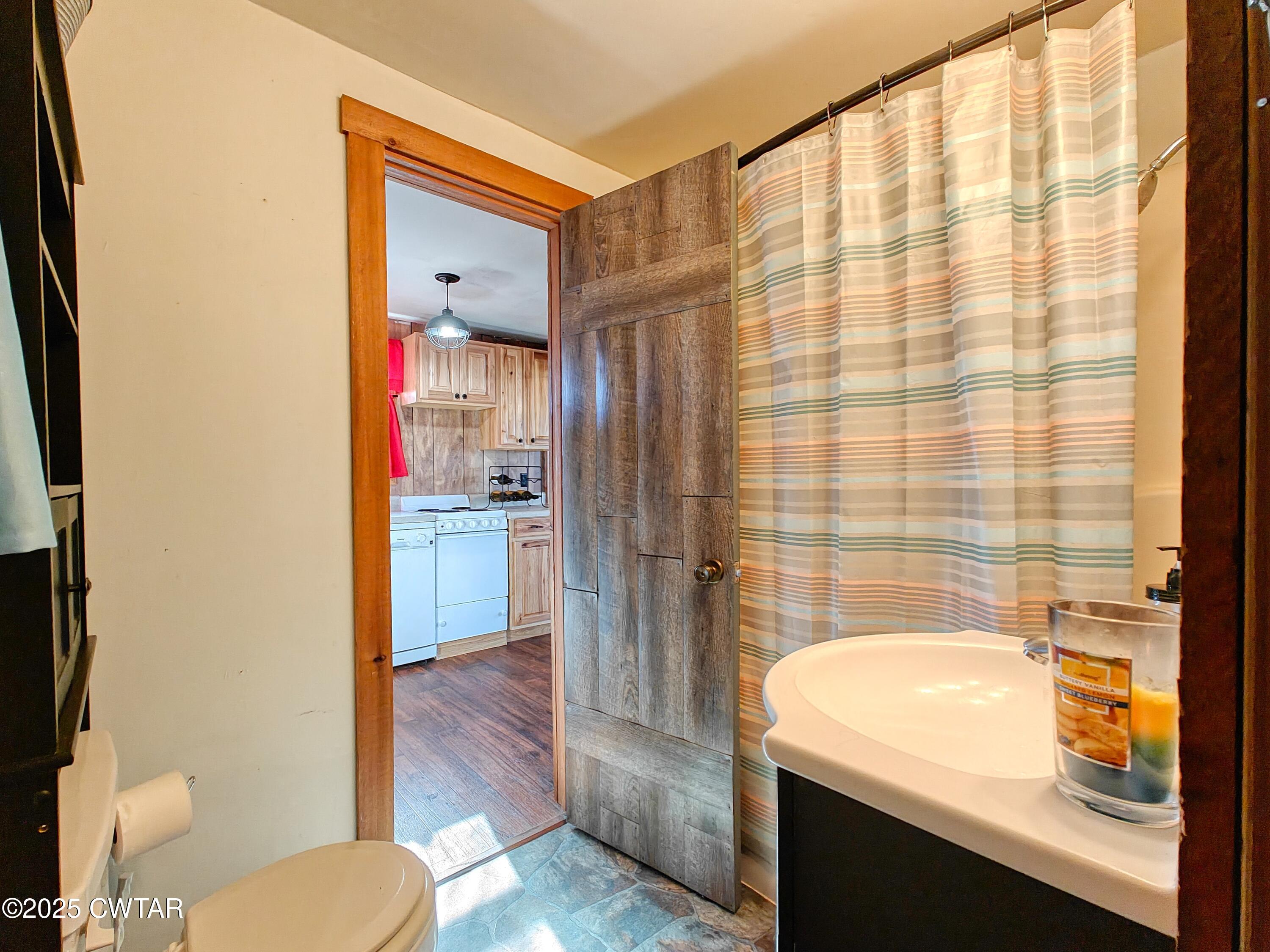 103 Grace Lane Eva, TN 38333 - Photo 19 of 25 a bathroom with a sink and a mirror