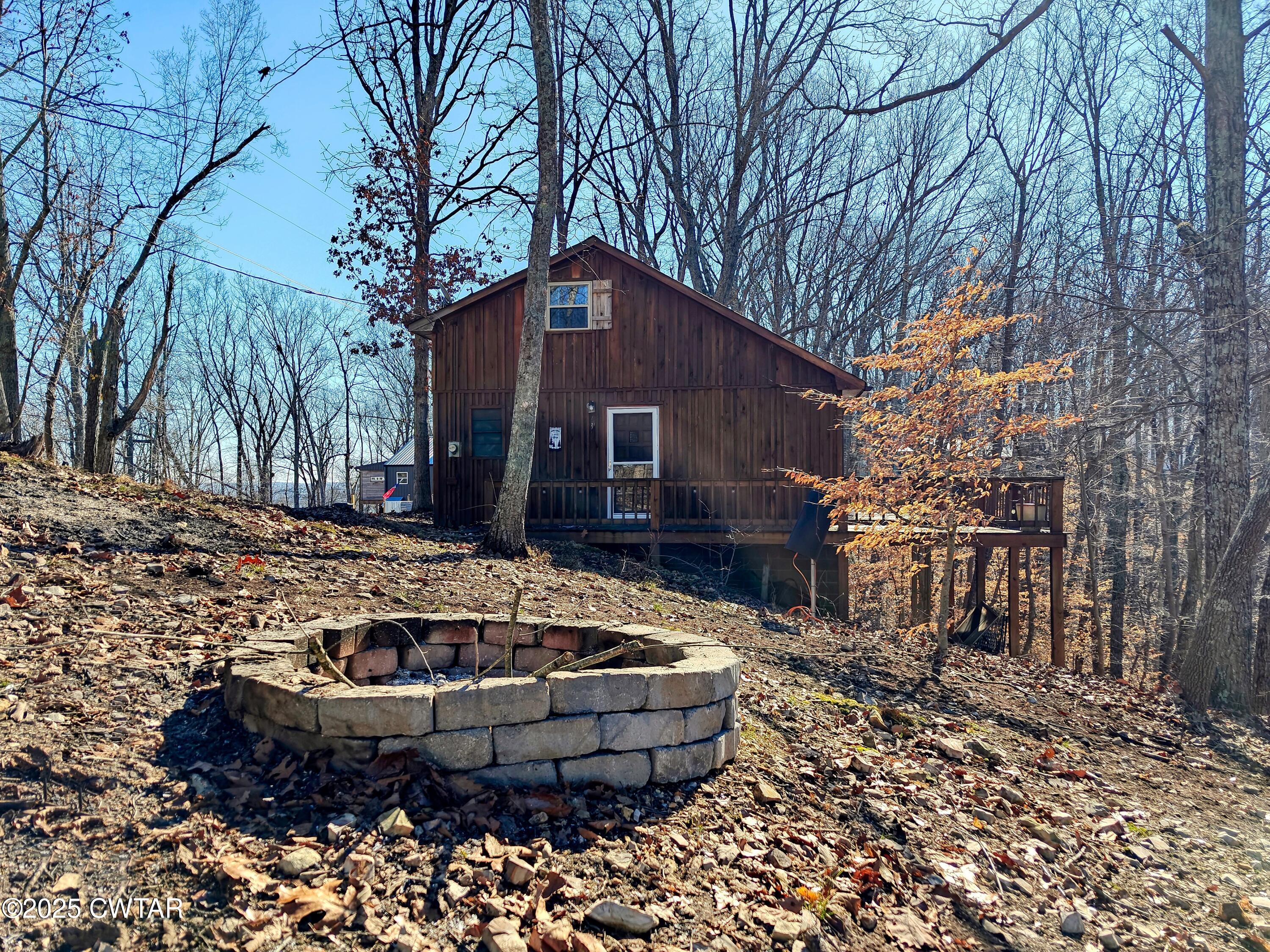 103 Grace Lane Eva, TN 38333 - Photo 24 of 25 a view of a house with a yard