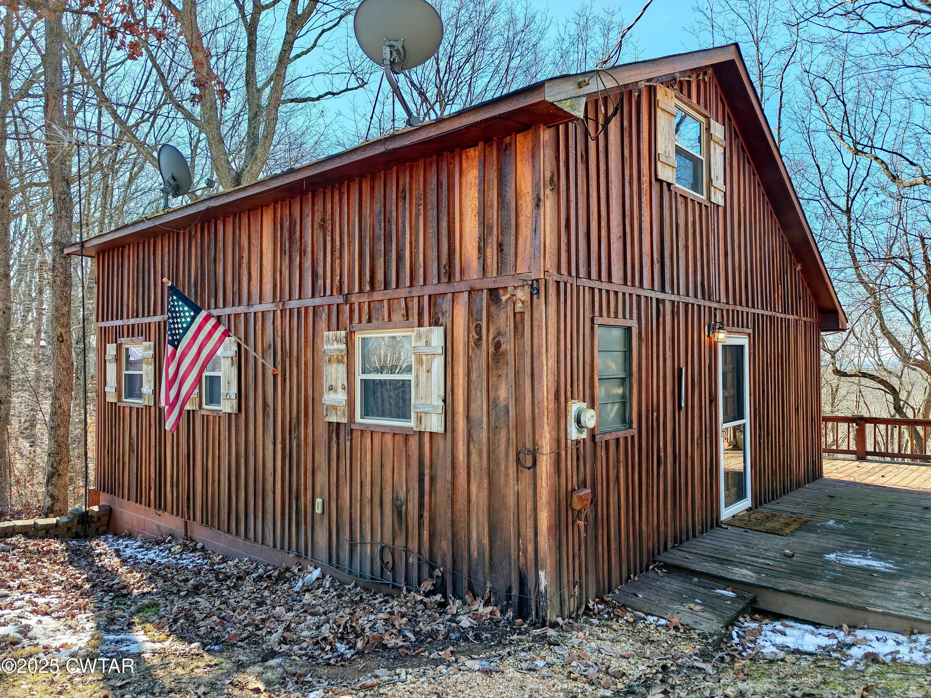103 Grace Lane Eva, TN 38333 - Photo 3 of 25 a view of a house with backyard and trees