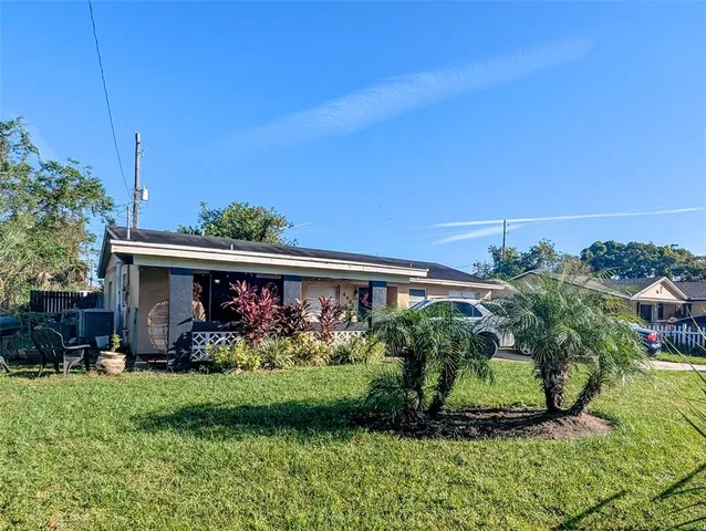 a view of house with yard