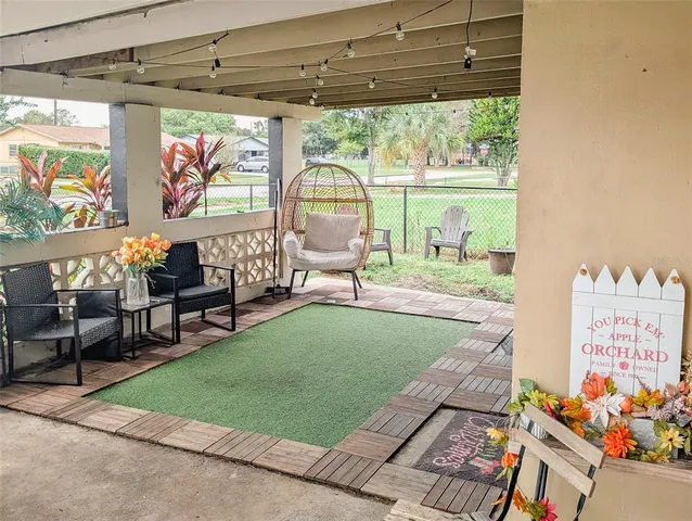 a living room with furniture and a window