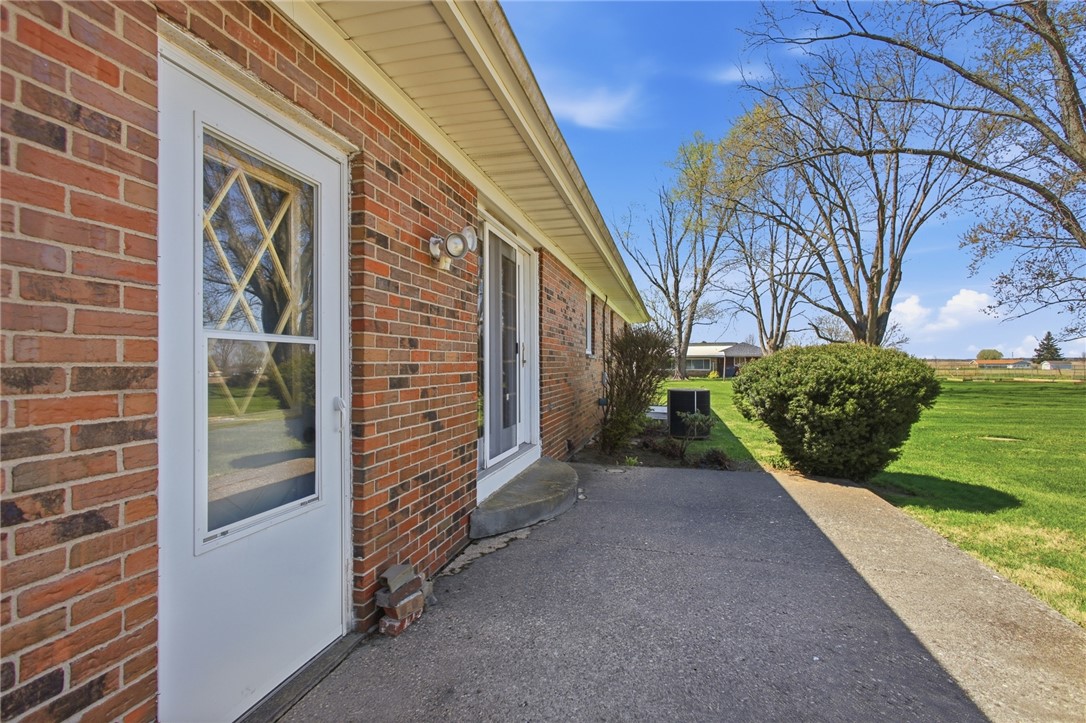6718 Old Columbus Road South Vienna, OH 45369 - Photo 30 of 33 This classic brick residence features a spacious concrete patio, ideal for outdoor enjoyment and serene living.