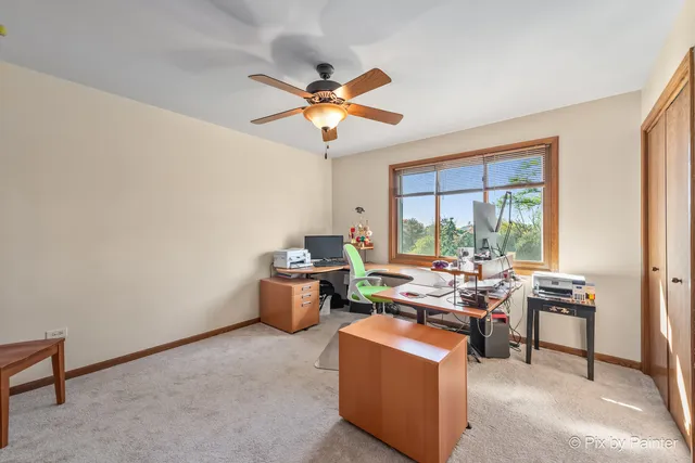 a view of yard with swimming pool and green space