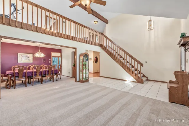 a kitchen with stainless steel appliances granite countertop a refrigerator a stove top oven a sink and dishwasher