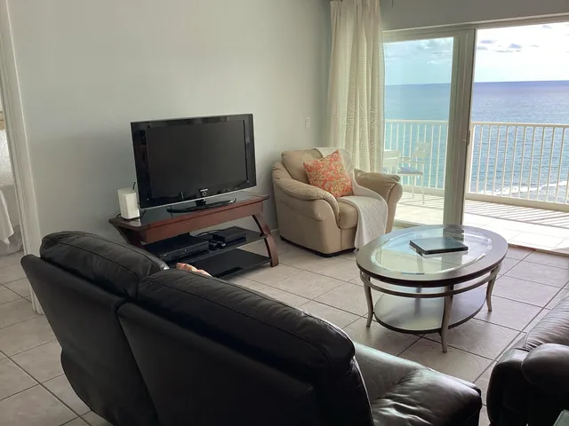 a living room with furniture and a lamp