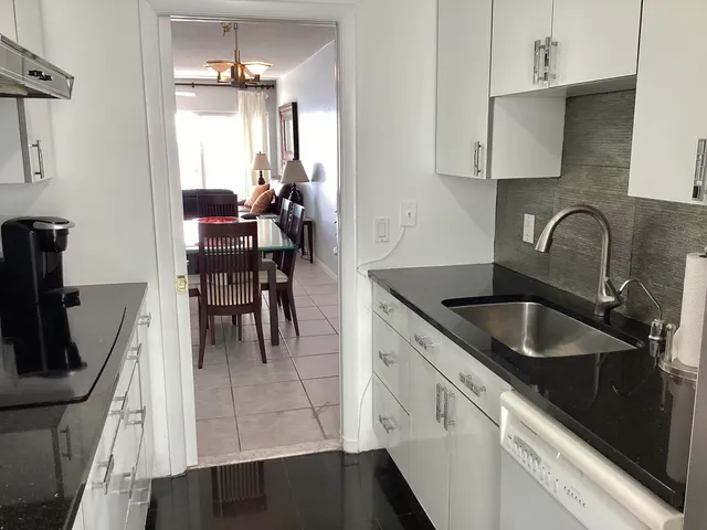 a bedroom with a bed and a flat tv screen in it