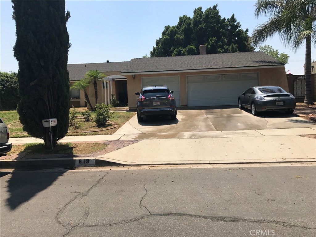 813 West Grove Street Rialto, CA 92376 - Photo 1 of 1 a car parked on the side of the road