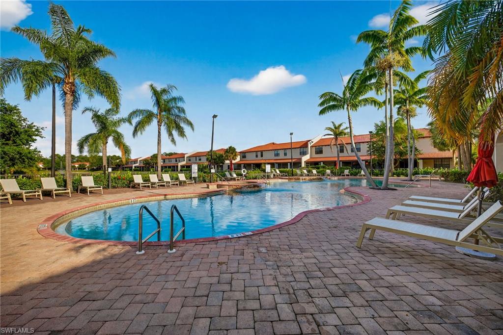 7845 Bristol Circle Naples, FL 34120 - Photo 27 of 31 a view of swimming pool with outdoor seating and plants