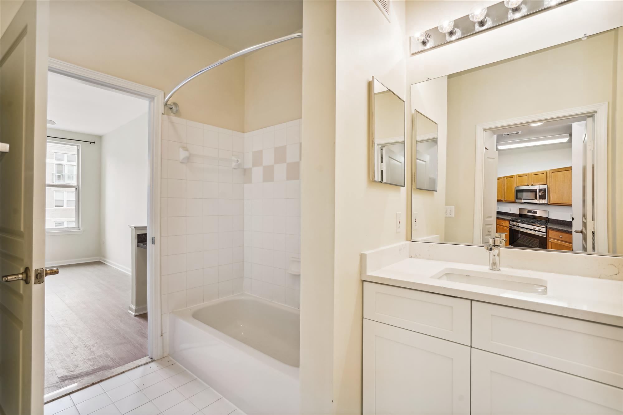 12000 Market Street, Unit 310 Reston, VA 20190 - Photo 14 of 22 Bathroom with connection to bedroom and entryway