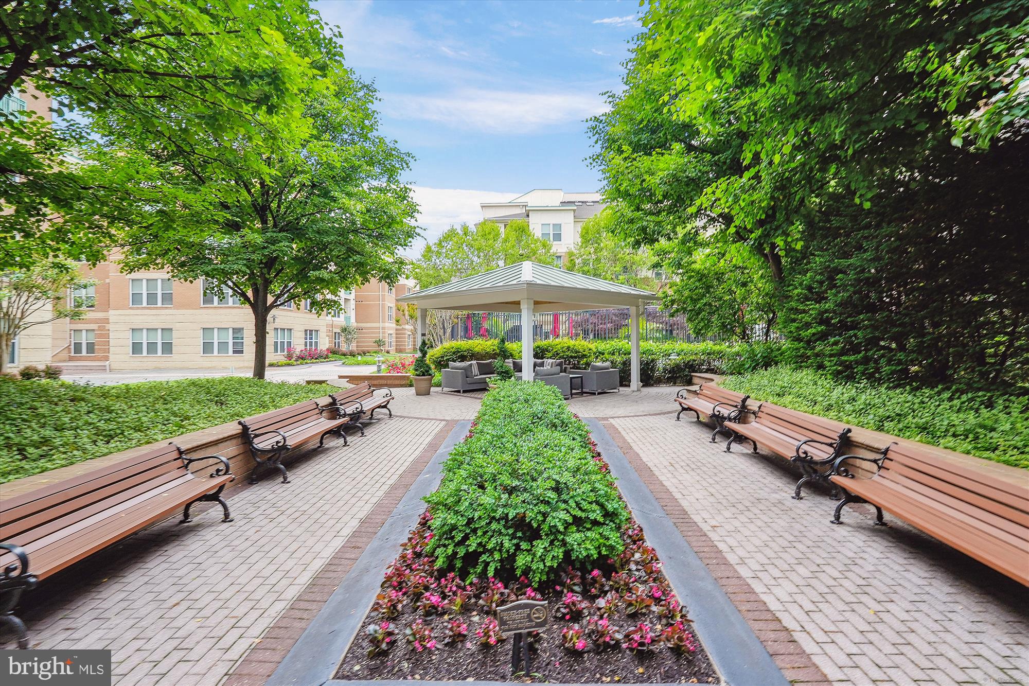 12000 Market Street, Unit 310 Reston, VA 20190 - Photo 20 of 22 Serene garden retreat with lush greenery.