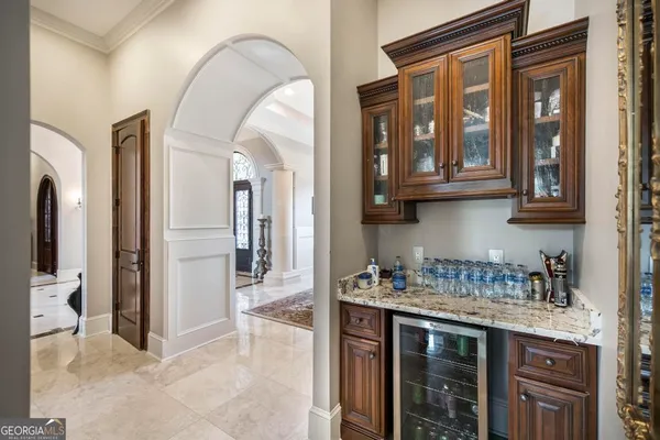 a view of living room with furniture and a chandelier