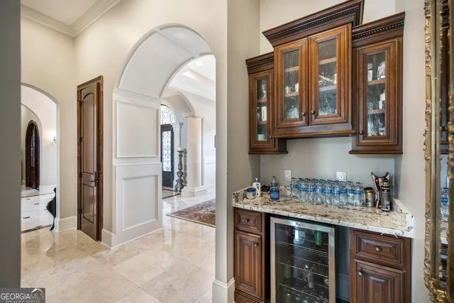 a view of living room with furniture and a chandelier