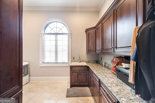 a bathroom with a double vanity sink mirror and bathtub