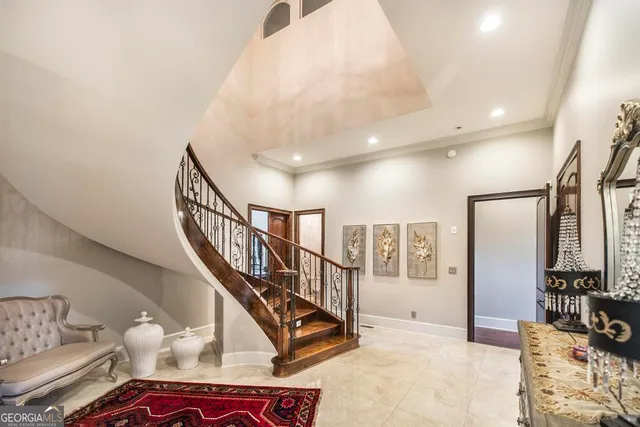 a bathroom with a bathtub a sink and a large mirror