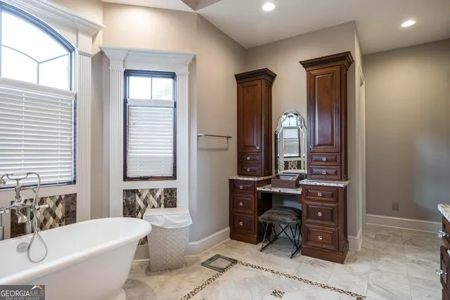 an aerial view of a house with yard swimming pool and outdoor seating