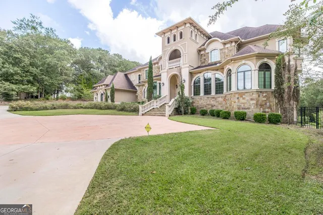a kitchen with stainless steel appliances granite countertop a sink and cabinets
