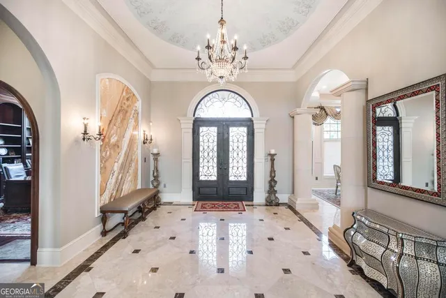 a kitchen with stainless steel appliances granite countertop a refrigerator a stove and a sink with wooden cabinets