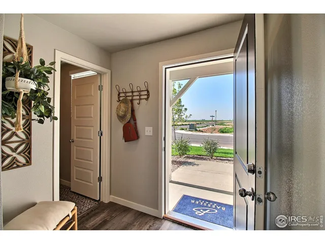 a bathroom with a toilet and a shower curtain