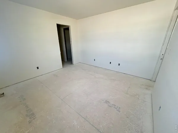 a kitchen with stainless steel appliances granite countertop sink refrigerator dining table and chairs