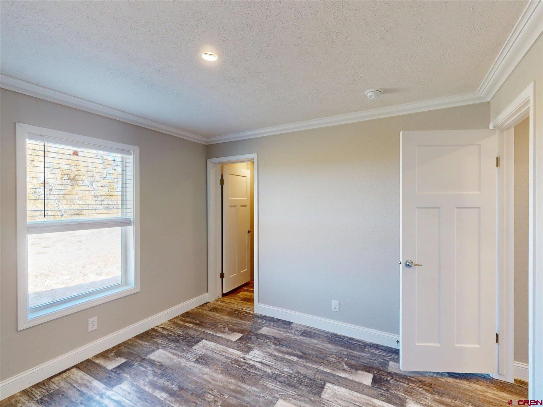 2229 Highway 160 Cortez, CO 81321 - Photo 16 of 32 a view of an empty room and window