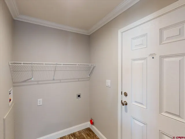 a lamp is sitting on a table and chair