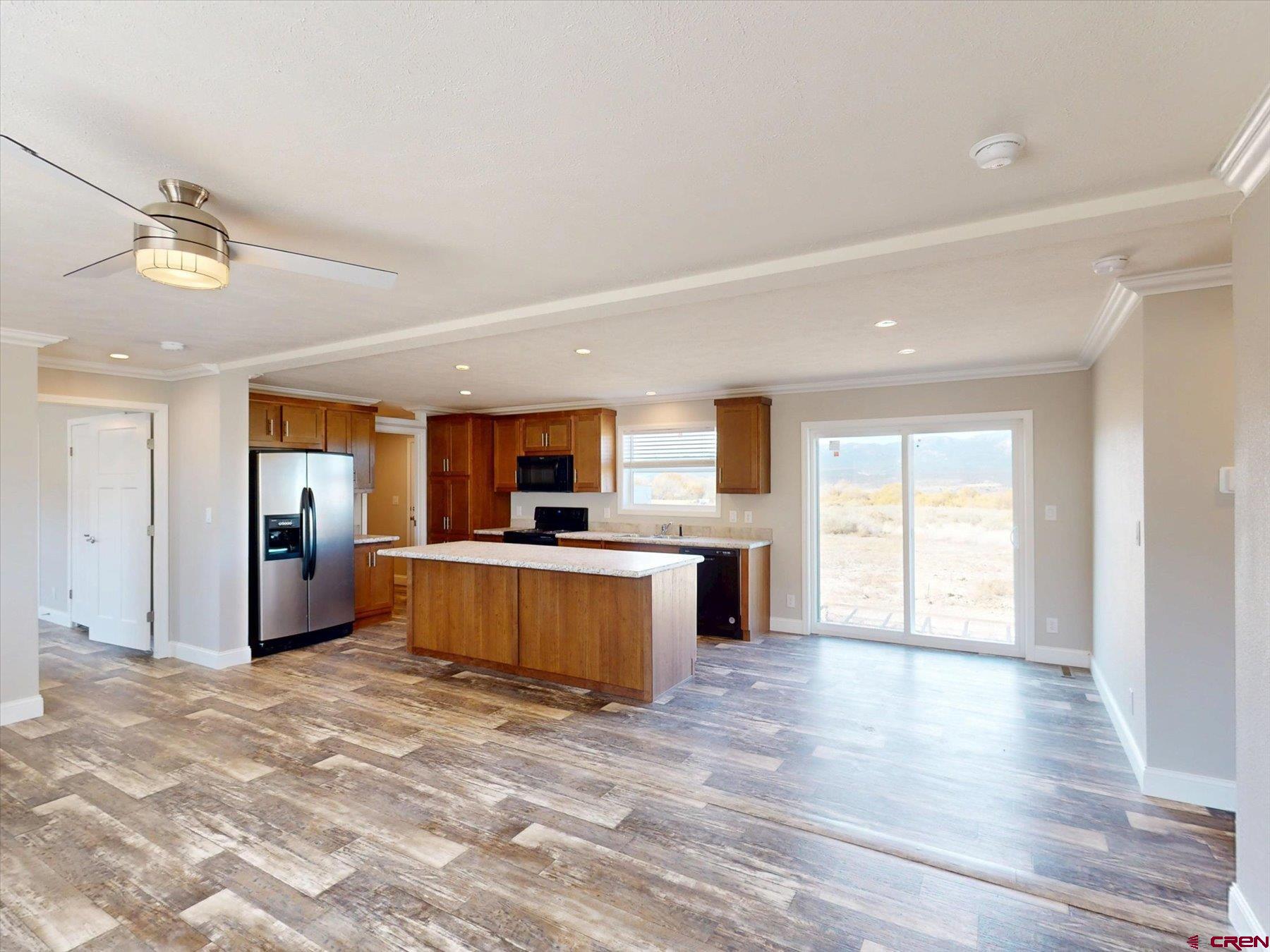 2229 Highway 160 Cortez, CO 81321 - Photo 5 of 32 a view of a kitchen with a sink and a large window