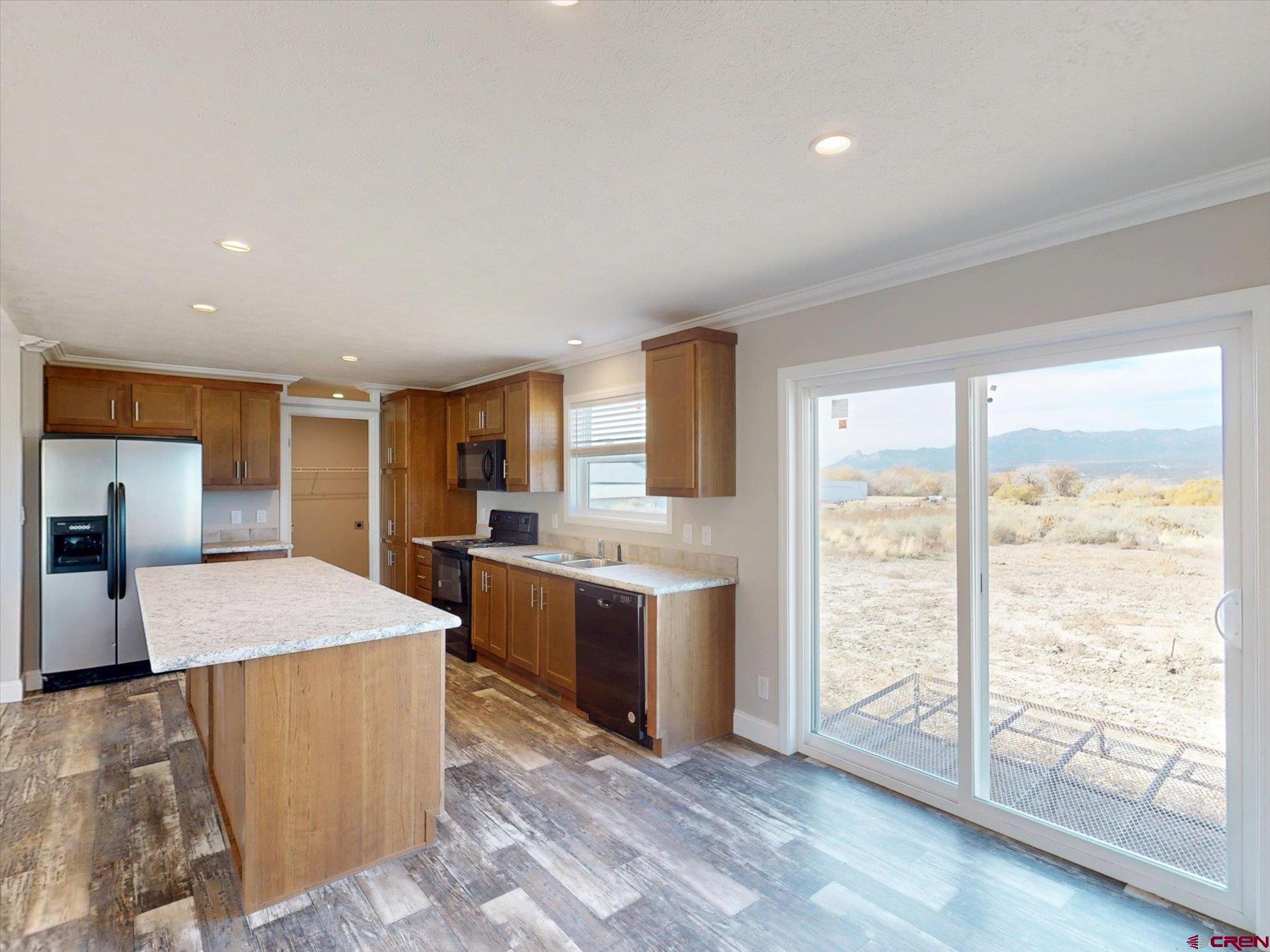 2229 Highway 160 Cortez, CO 81321 - Photo 6 of 32 a large kitchen with lots of counter top space and stainless steel appliances