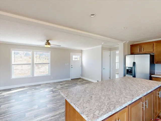 a view of a kitchen cabinets and wooden floor
