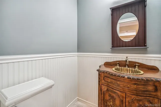 a bathroom with a sink a vanity and a mirror