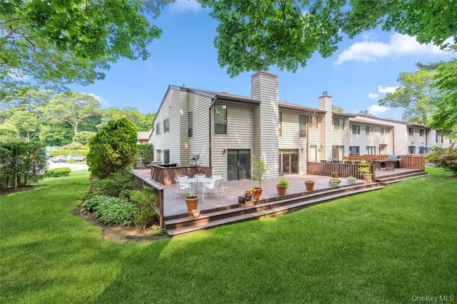 a front view of house with yard and outdoor seating