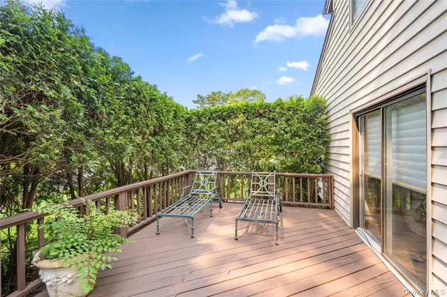 a view of balcony with deck and outdoor seating