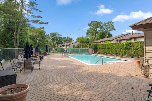 a view of a patio with a table and chairs