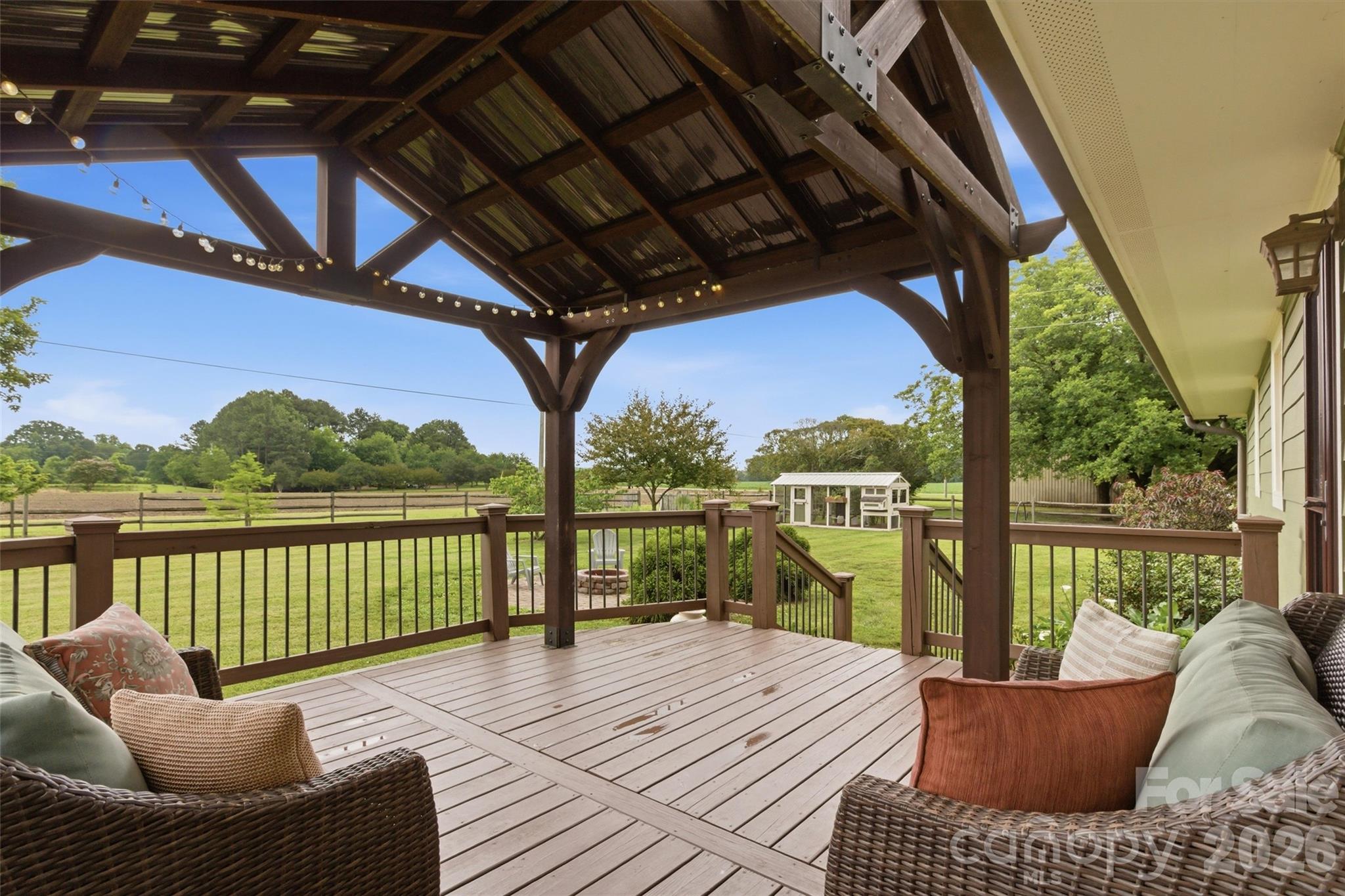4712 Secrest Short Cut Road Monroe, NC 28110 - Photo 20 of 30 a view of a balcony with wooden floor and outdoor seating