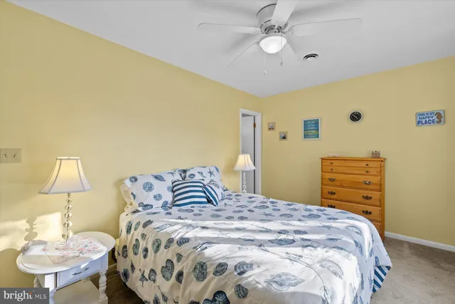 a bedroom with a bed and a table in it